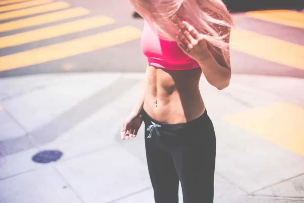 Woman with toned stomach after LA-EMS Body Sculpting Treatment Ham