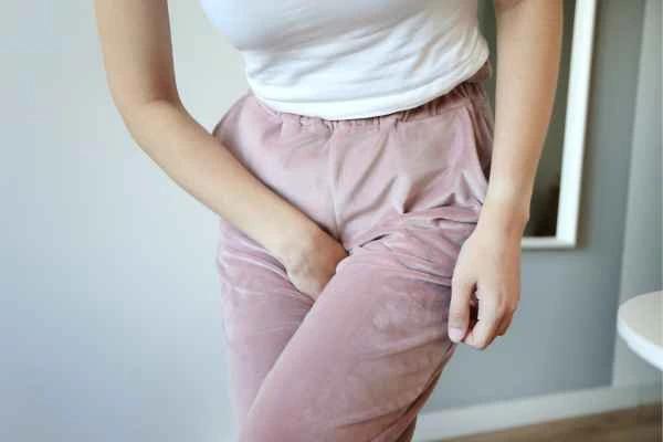 woman running for the toilet because of urinary incontinence Ham